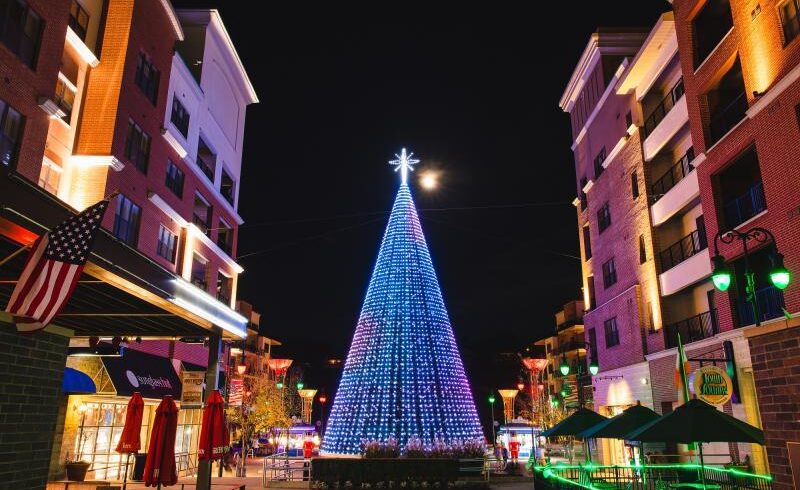 Image of a Christmas tree on the Branson Landing lit with brilliant and colorful LED lights.