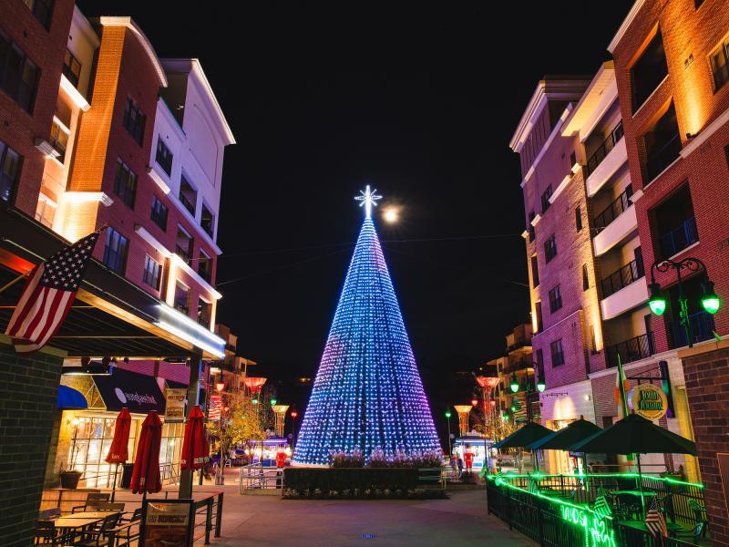 Image of a Christmas tree on the Branson Landing lit with brilliant and colorful LED lights.